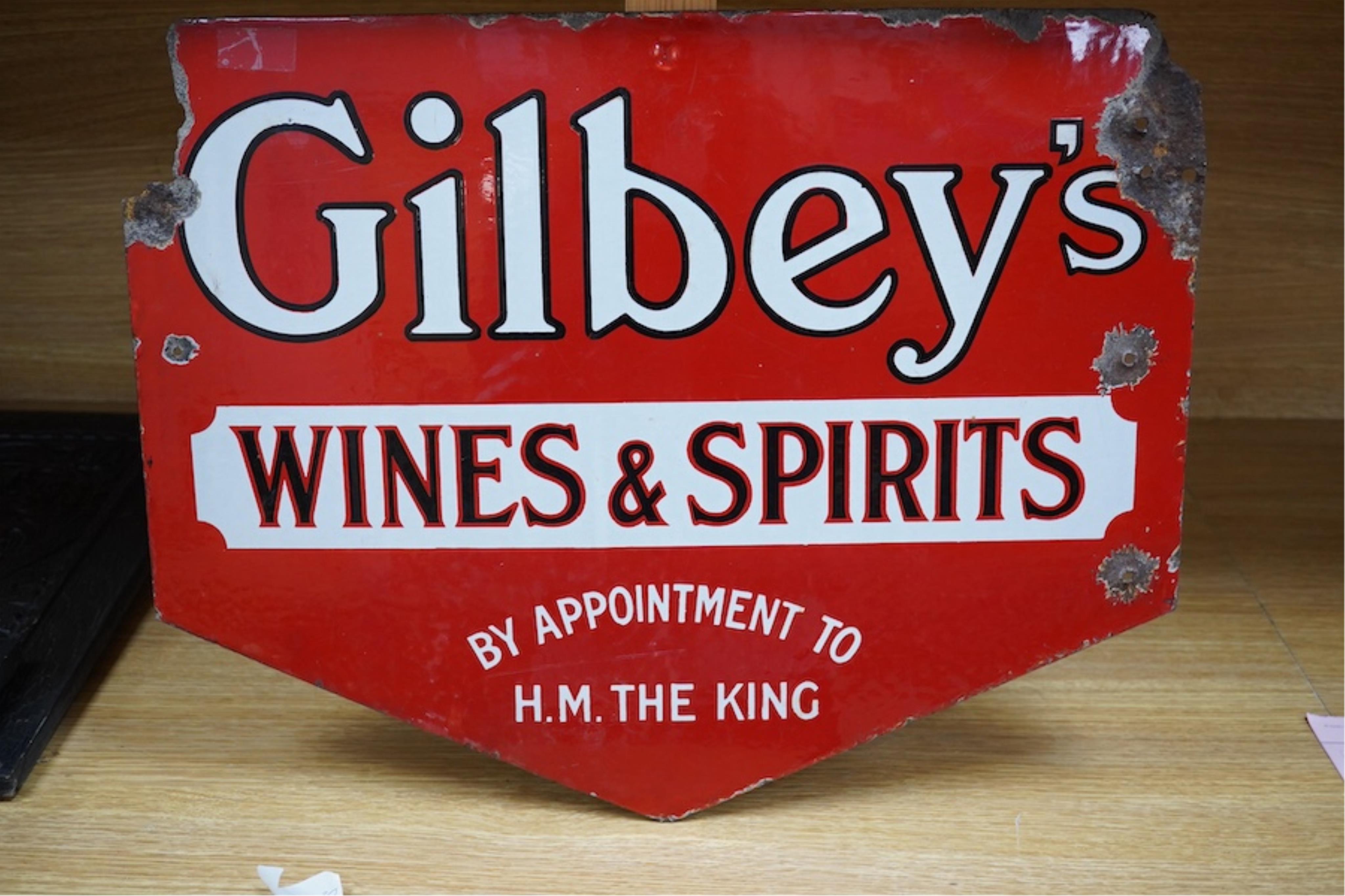 A 1930's double sided Gilbey's Wines & Spirits enamel sign, 41.5cm high. Condition - as per online images